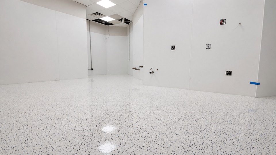 Clean white, gray and blue decorative flake floor coating